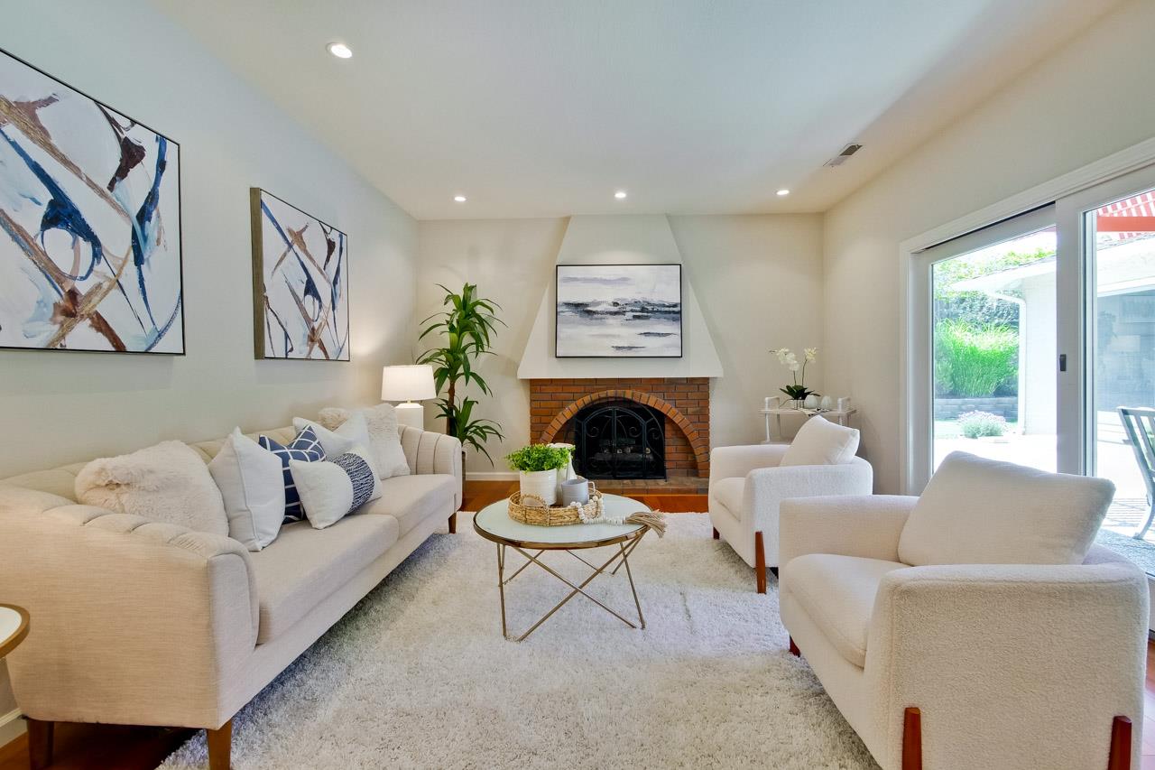11131 Bubb Road Cupertino, CA 95014 - Photo 24 of 56 a living room with furniture and a fireplace