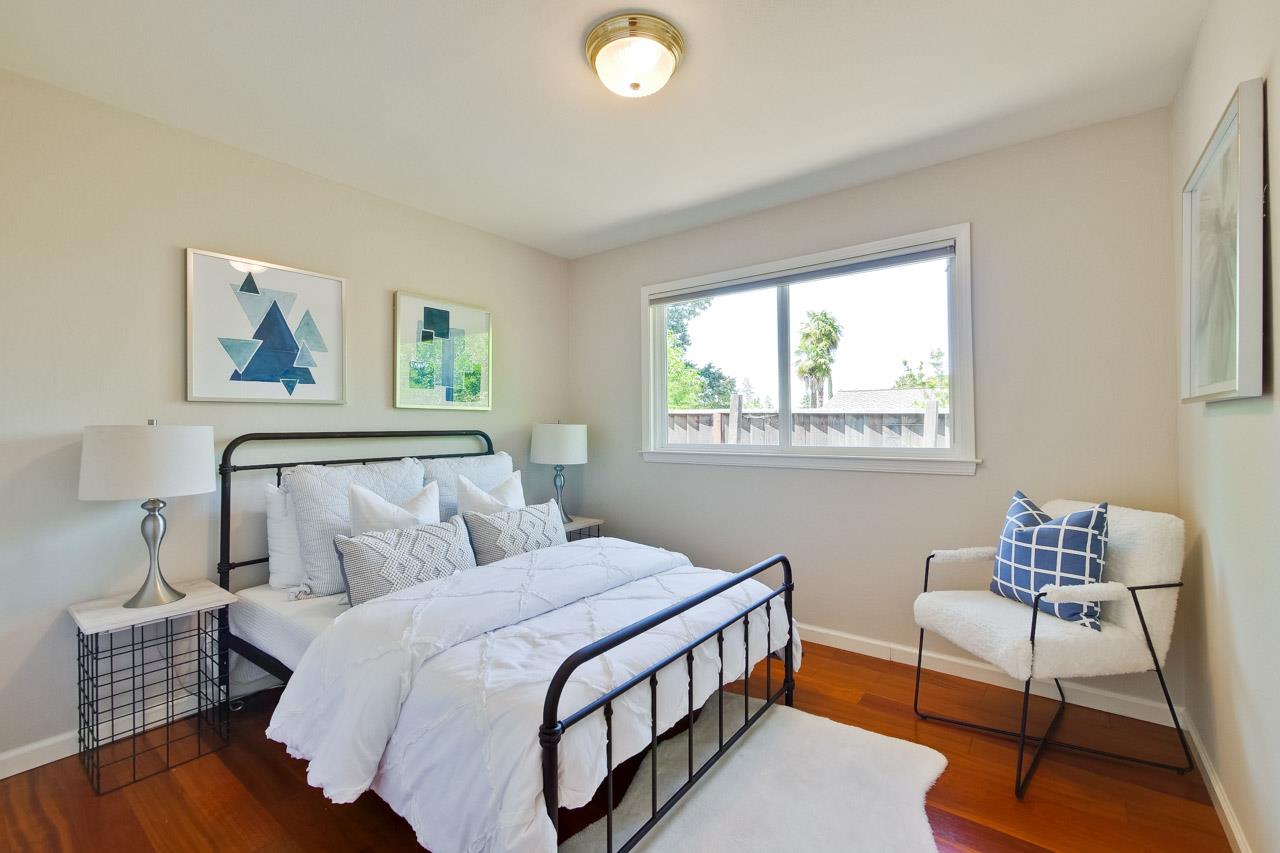 11131 Bubb Road Cupertino, CA 95014 - Photo 28 of 56 a bedroom with a bed and a window