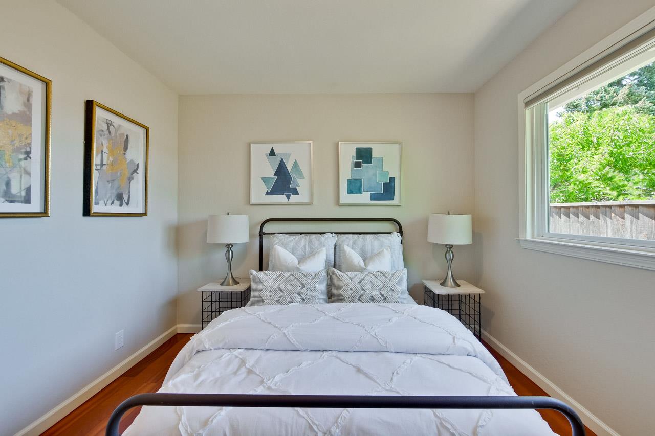11131 Bubb Road Cupertino, CA 95014 - Photo 29 of 56 a bedroom with a bed and painting on the wall