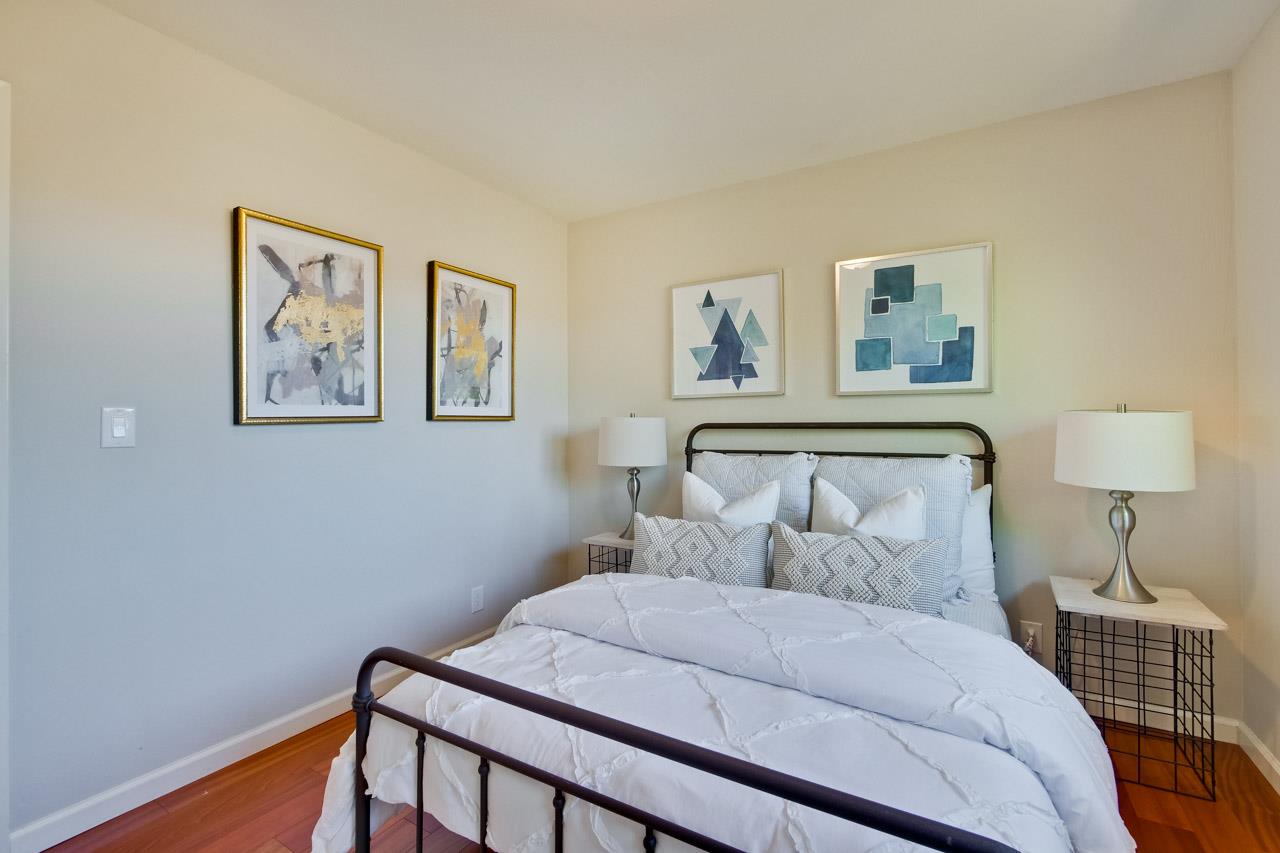 11131 Bubb Road Cupertino, CA 95014 - Photo 30 of 56 a bedroom with a bed and a lamp on dresser