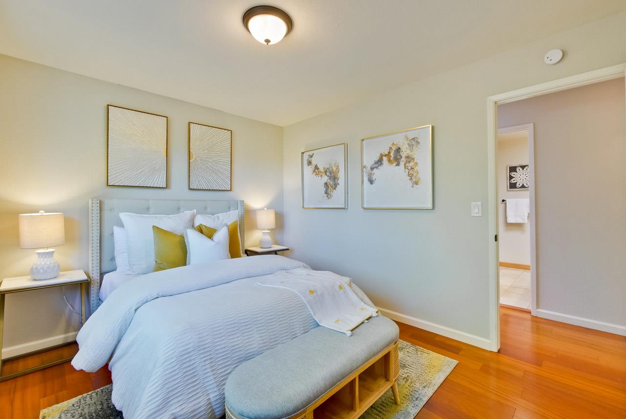 11131 Bubb Road Cupertino, CA 95014 - Photo 32 of 56 a bedroom with a bed and wooden floor