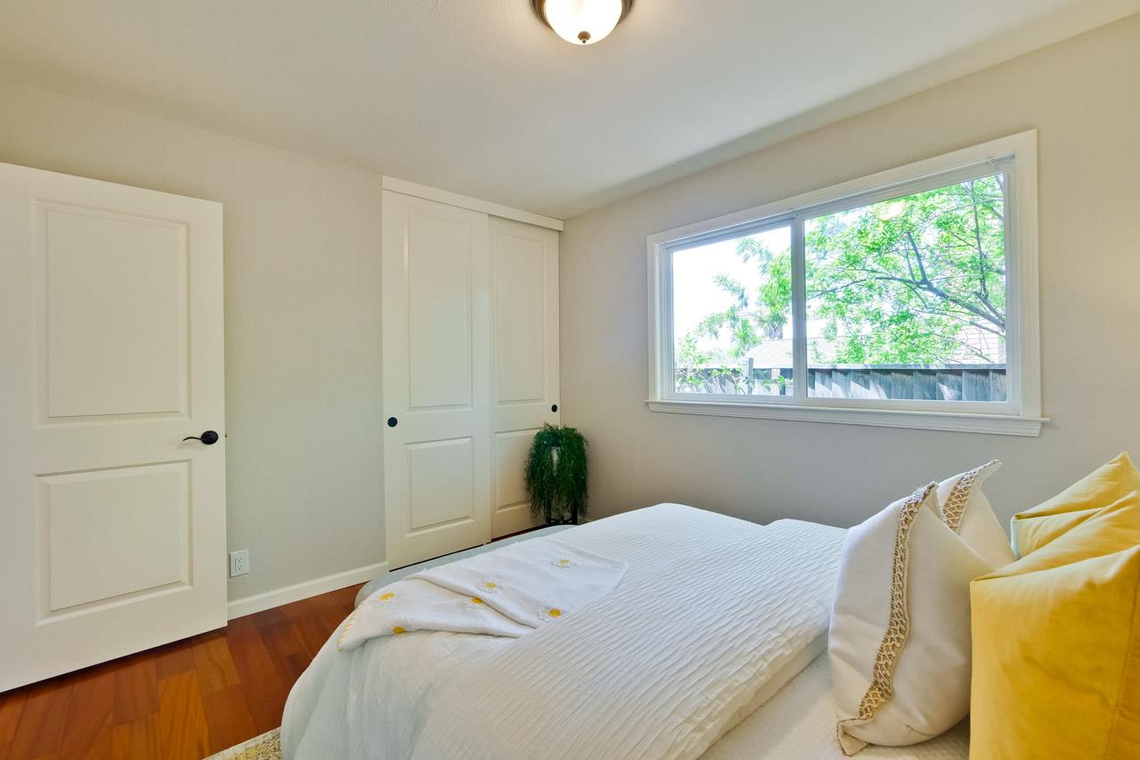 11131 Bubb Road Cupertino, CA 95014 - Photo 33 of 56 a bedroom with a bed and a window