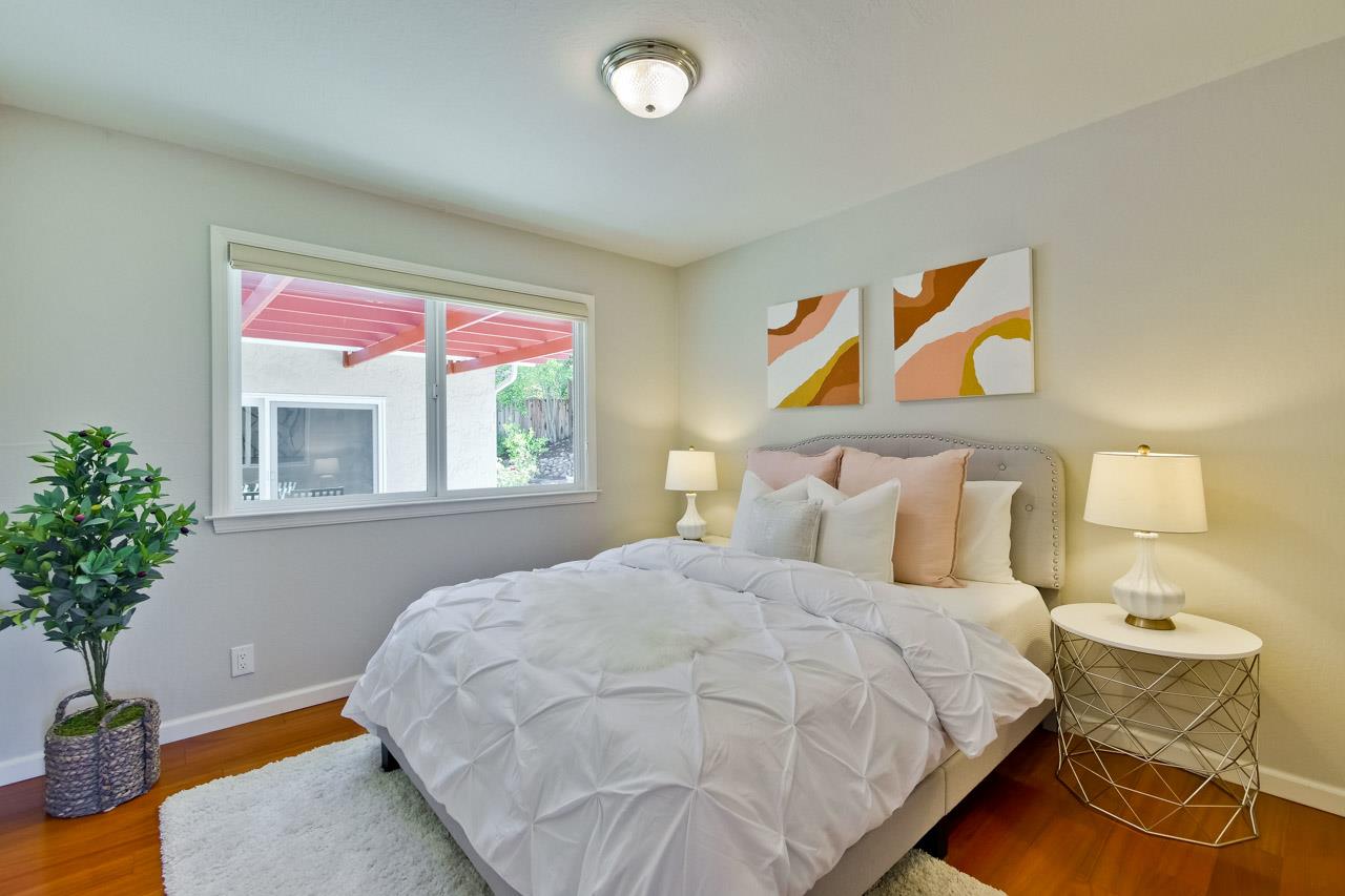 11131 Bubb Road Cupertino, CA 95014 - Photo 34 of 56 a bedroom with a bed and a potted plant