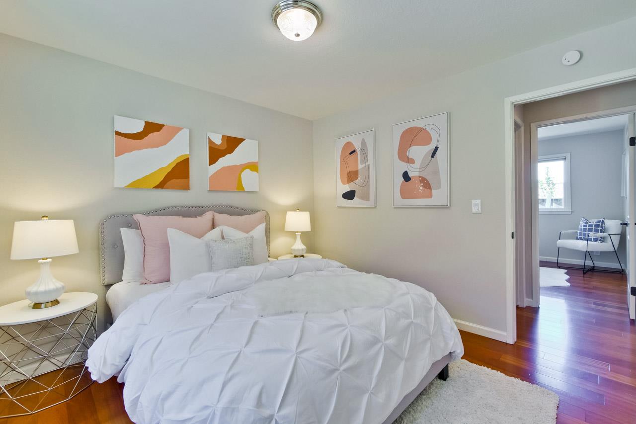 11131 Bubb Road Cupertino, CA 95014 - Photo 35 of 56 a bedroom with a bed and painting on the wall