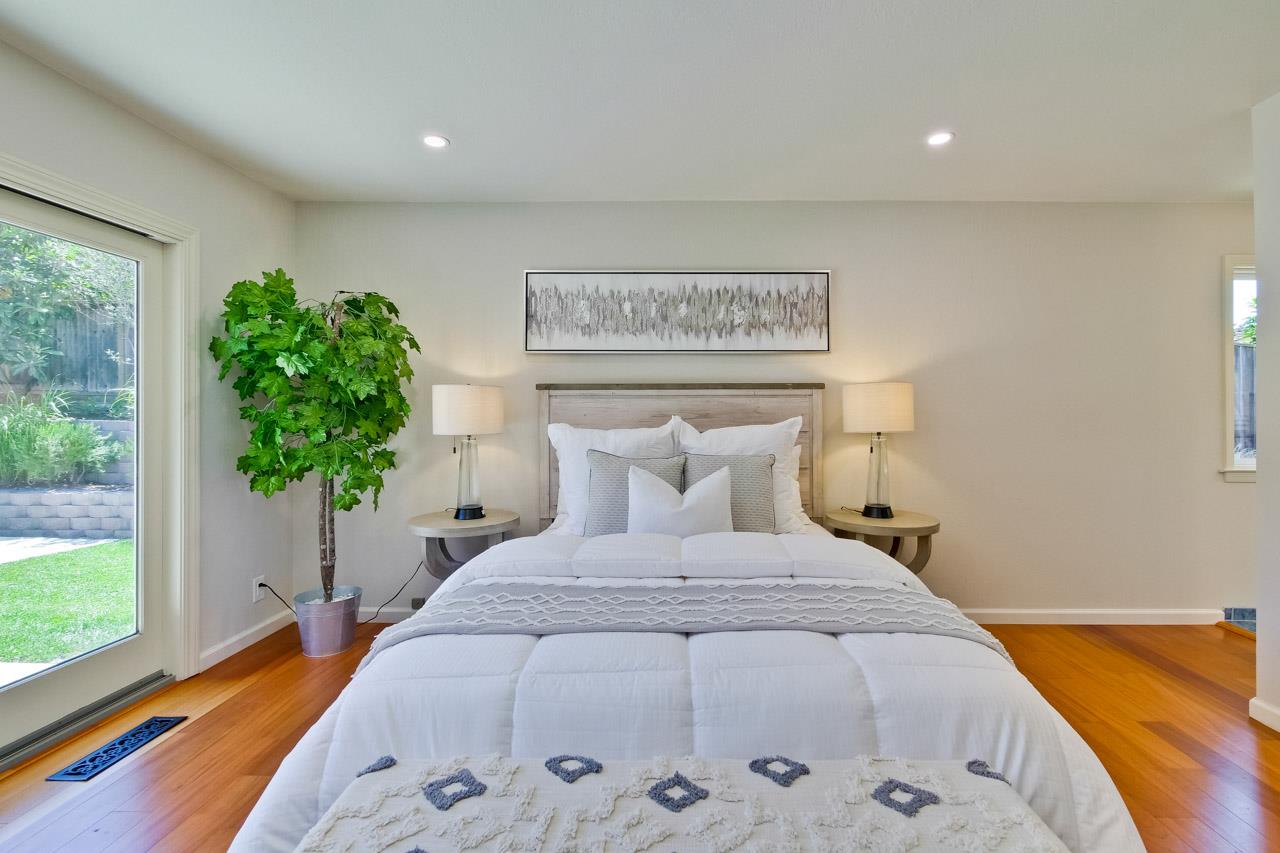 11131 Bubb Road Cupertino, CA 95014 - Photo 44 of 56 a bed sitting in a spacious bedroom next to a window