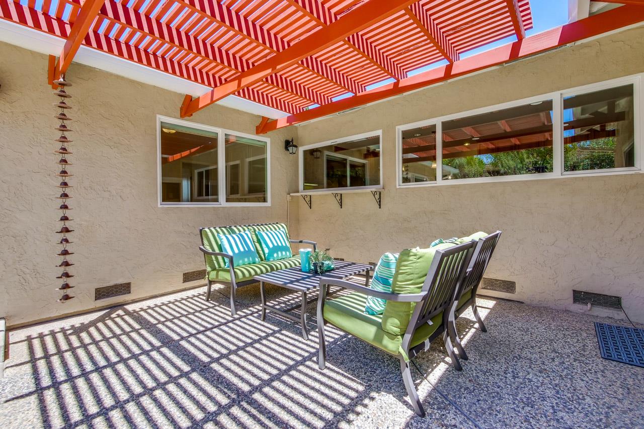 11131 Bubb Road Cupertino, CA 95014 - Photo 54 of 56 a view of a house with backyard sitting area and furniture