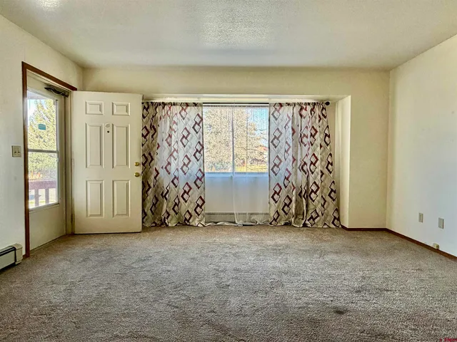 a view of an empty room with a window