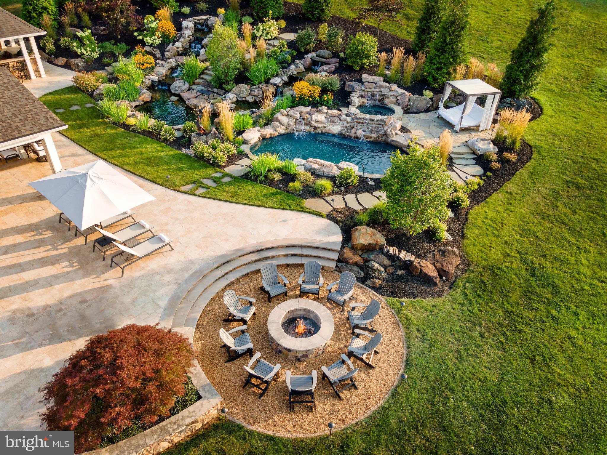 7484 Wilson Road Warrenton, VA 20186 - Photo 12 of 81 an aerial view of a house with a swimming pool and outdoor seating