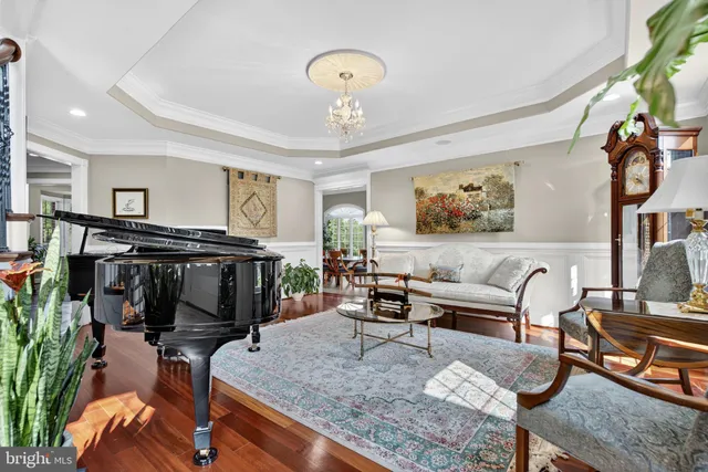 a room with pool table and wooden floor