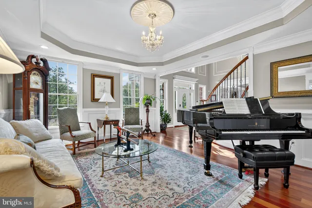 a bedroom with a bed and a lamp on dresser