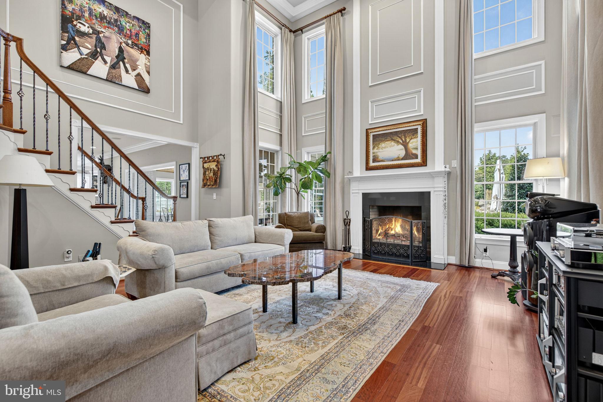 7484 Wilson Road Warrenton, VA 20186 - Photo 35 of 81 a living room with furniture fireplace and a table