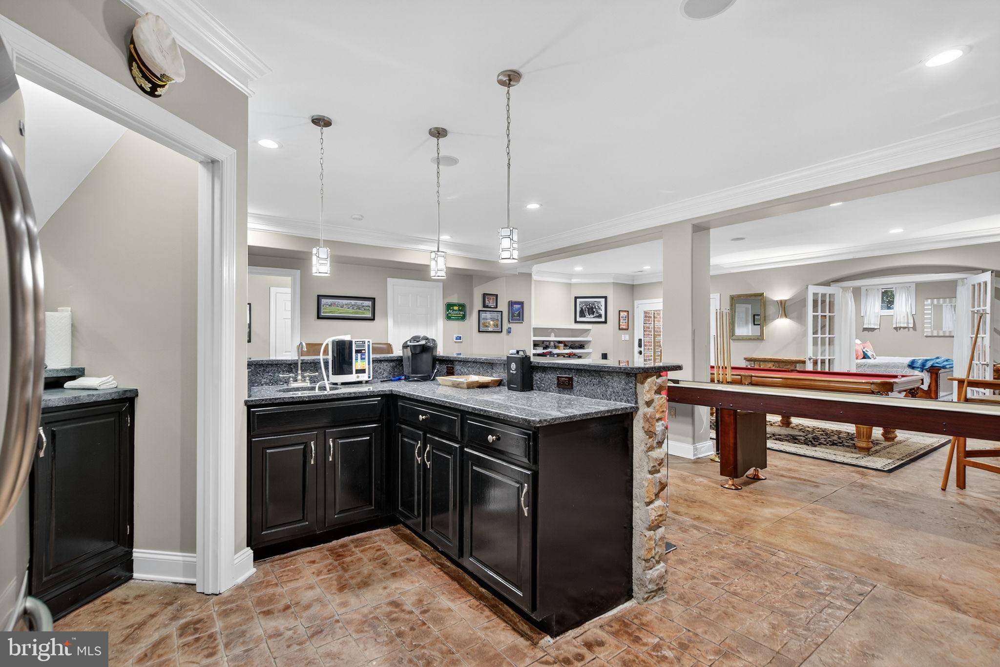 7484 Wilson Road Warrenton, VA 20186 - Photo 43 of 81 a kitchen with stainless steel appliances granite countertop a sink a stove and a refrigerator