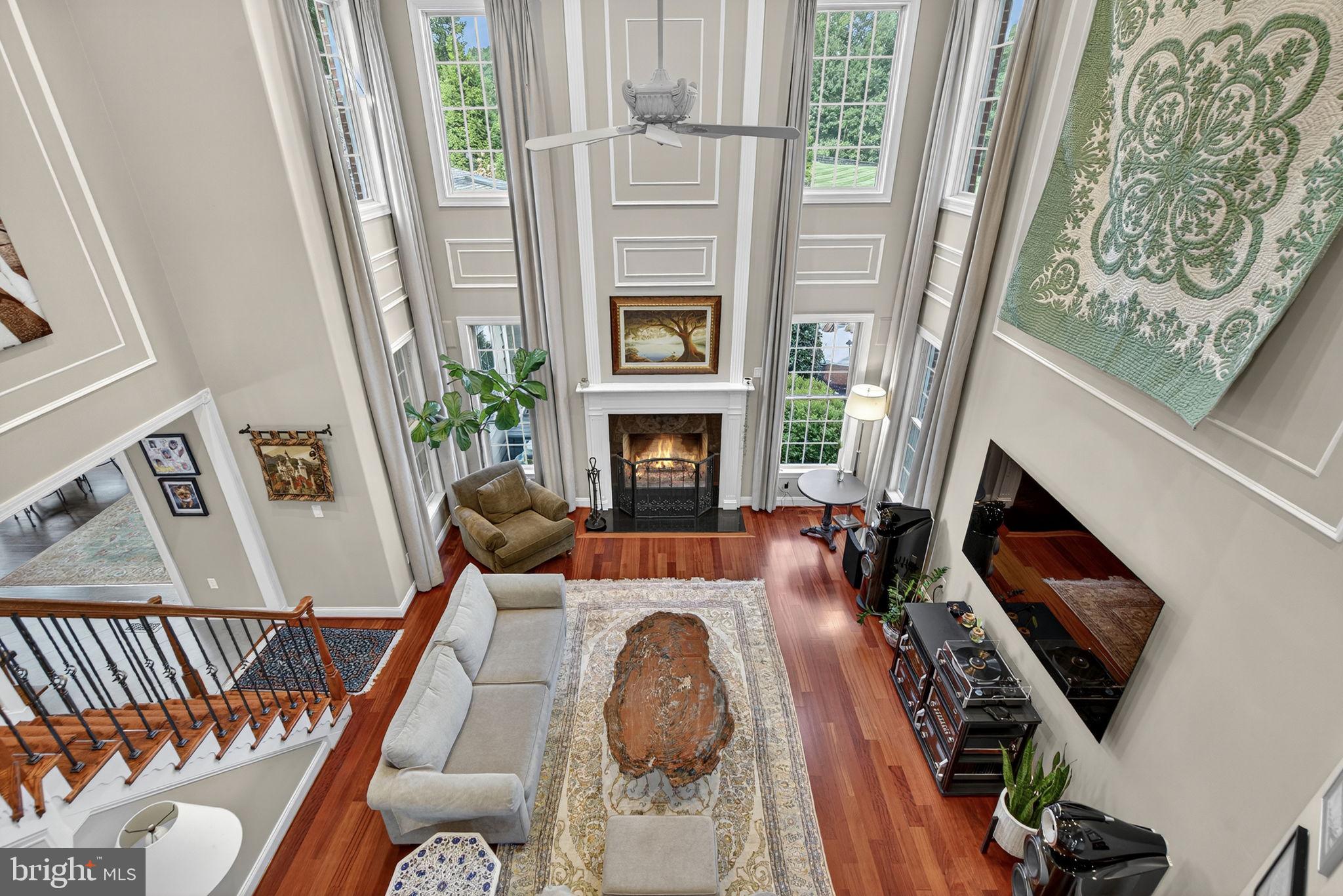 7484 Wilson Road Warrenton, VA 20186 - Photo 52 of 81 a living room with furniture and a fireplace