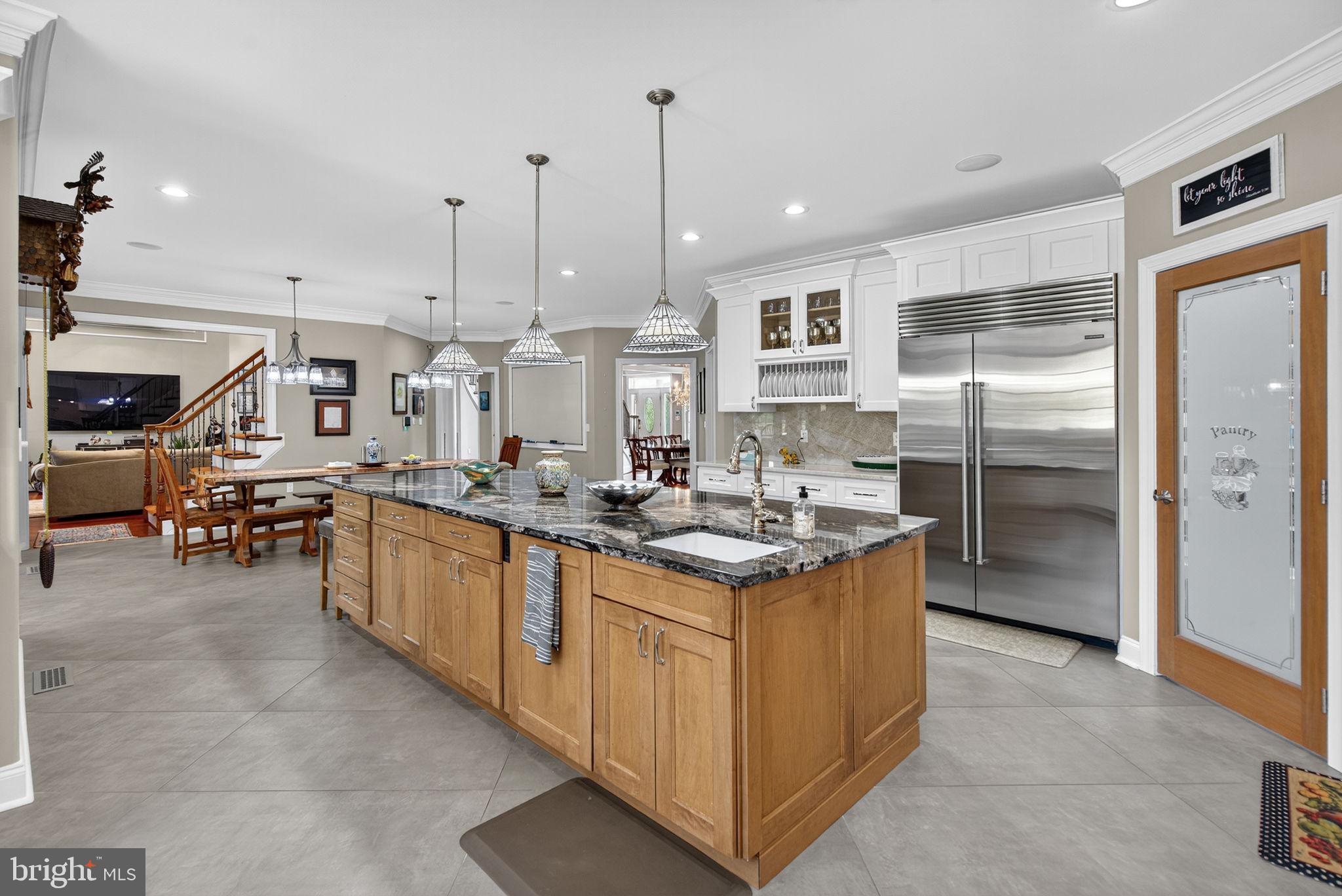 7484 Wilson Road Warrenton, VA 20186 - Photo 63 of 81 a kitchen with stainless steel appliances granite countertop a sink and cabinets