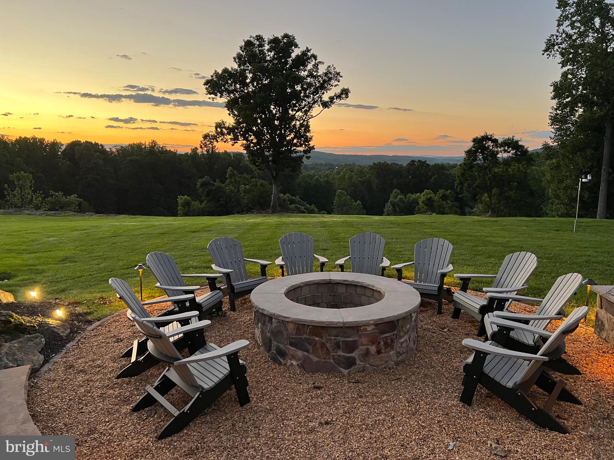 7484 Wilson Road Warrenton, VA 20186 - Photo 7 of 81 a view of a swimming pool and lounge chairs