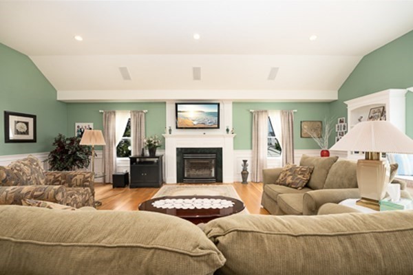 32 Columbus Road Marshfield, MA 02050 - Photo 19 of 37 a living room with furniture and a fireplace