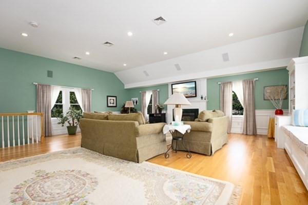 32 Columbus Road Marshfield, MA 02050 - Photo 21 of 37 a living room with furniture and a fireplace