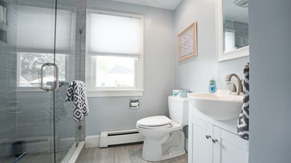 32 Columbus Road Marshfield, MA 02050 - Photo 22 of 37 a bathroom with a sink toilet and shower