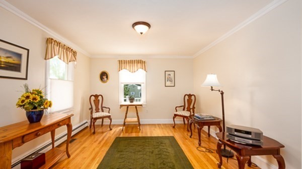 32 Columbus Road Marshfield, MA 02050 - Photo 23 of 37 a living room with furniture and flowers