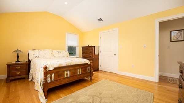 32 Columbus Road Marshfield, MA 02050 - Photo 28 of 37 a spacious bedroom with a bed and a table in it