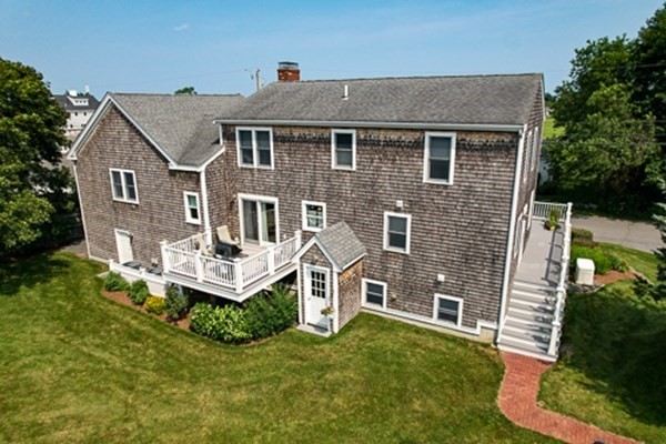 32 Columbus Road Marshfield, MA 02050 - Photo 34 of 37 a aerial view of a house with a yard porch and furniture