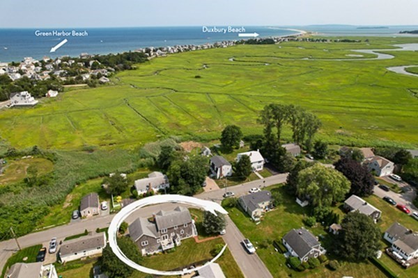 32 Columbus Road Marshfield, MA 02050 - Photo 4 of 37 a view of a lake with a houses