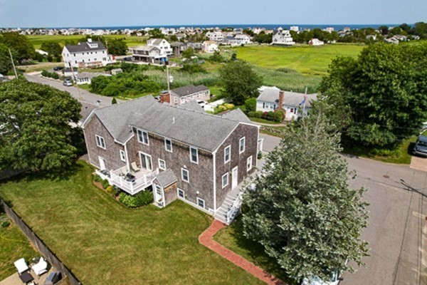 32 Columbus Road Marshfield, MA 02050 - Photo 7 of 37 an aerial view of a house with a garden and lake view