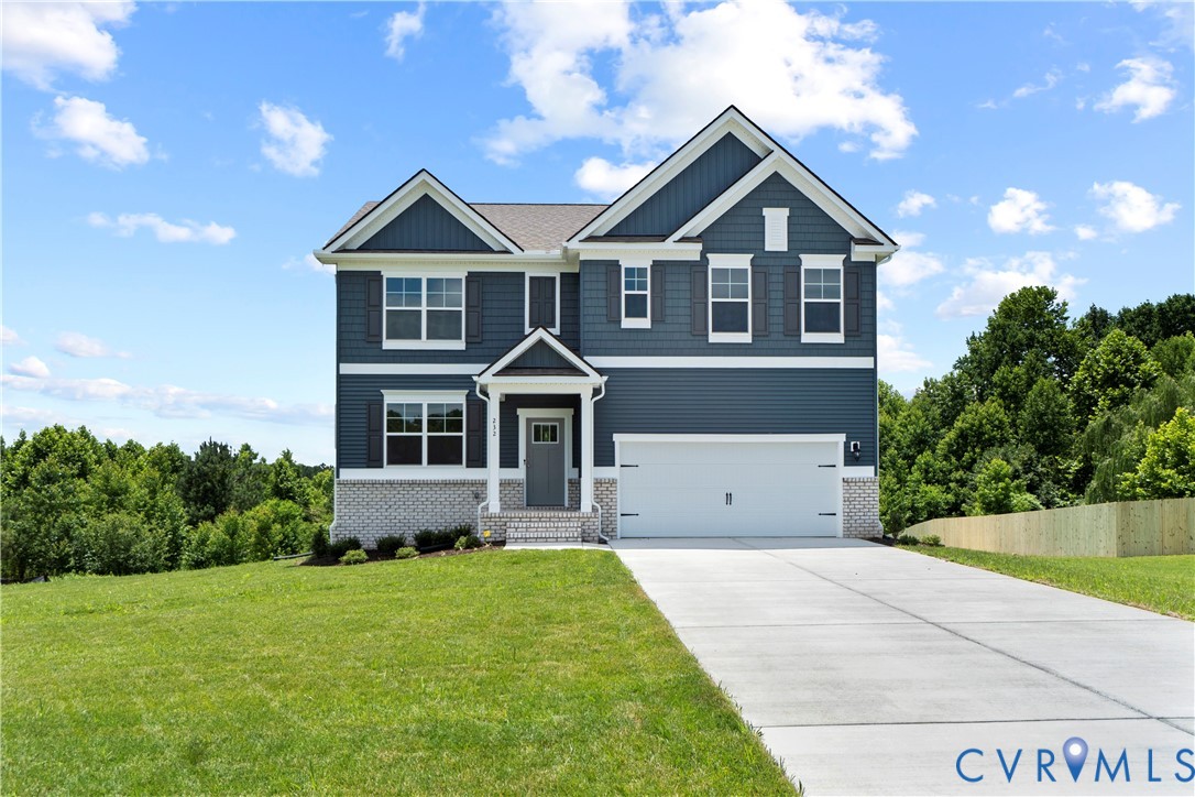 155 Liberty Lane Keswick, VA 22947 - Photo 1 of 32 a front view of a house with a yard and garage