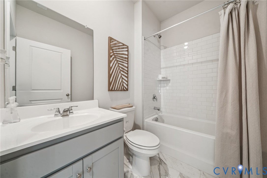 155 Liberty Lane Keswick, VA 22947 - Photo 11 of 32 a bathroom with a sink a toilet and shower