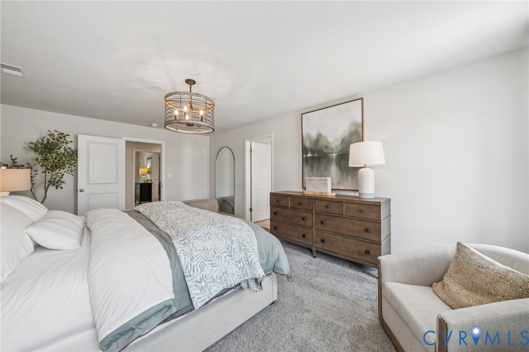 155 Liberty Lane Keswick, VA 22947 - Photo 16 of 32 a bedroom with a bed and wooden floor
