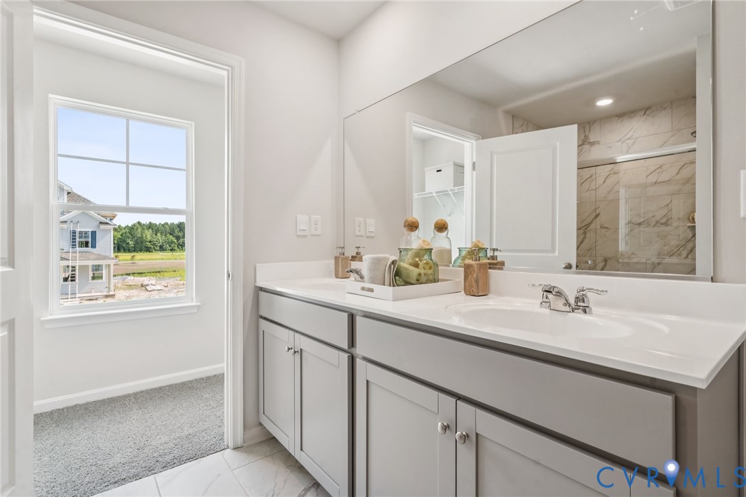 155 Liberty Lane Keswick, VA 22947 - Photo 19 of 32 a bathroom with a sink double vanity and a mirror