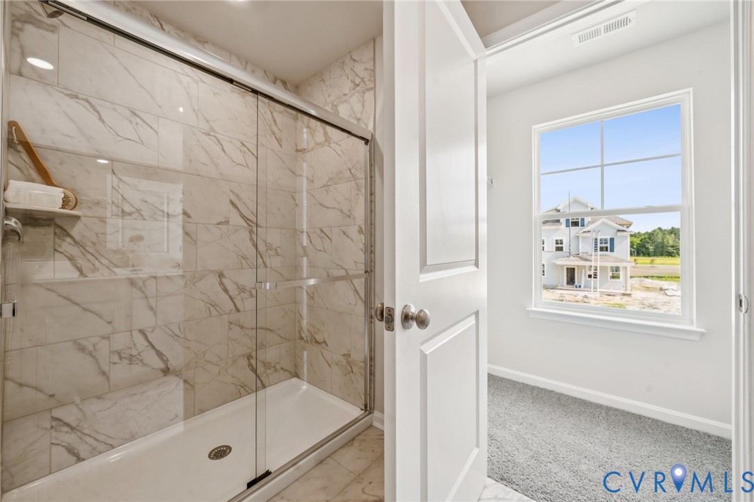 155 Liberty Lane Keswick, VA 22947 - Photo 21 of 32 a bathroom with a bathtub and shower