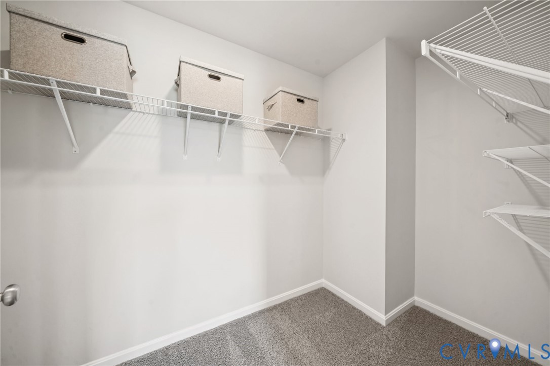 155 Liberty Lane Keswick, VA 22947 - Photo 22 of 32 a view of walk in closet with empty racks
