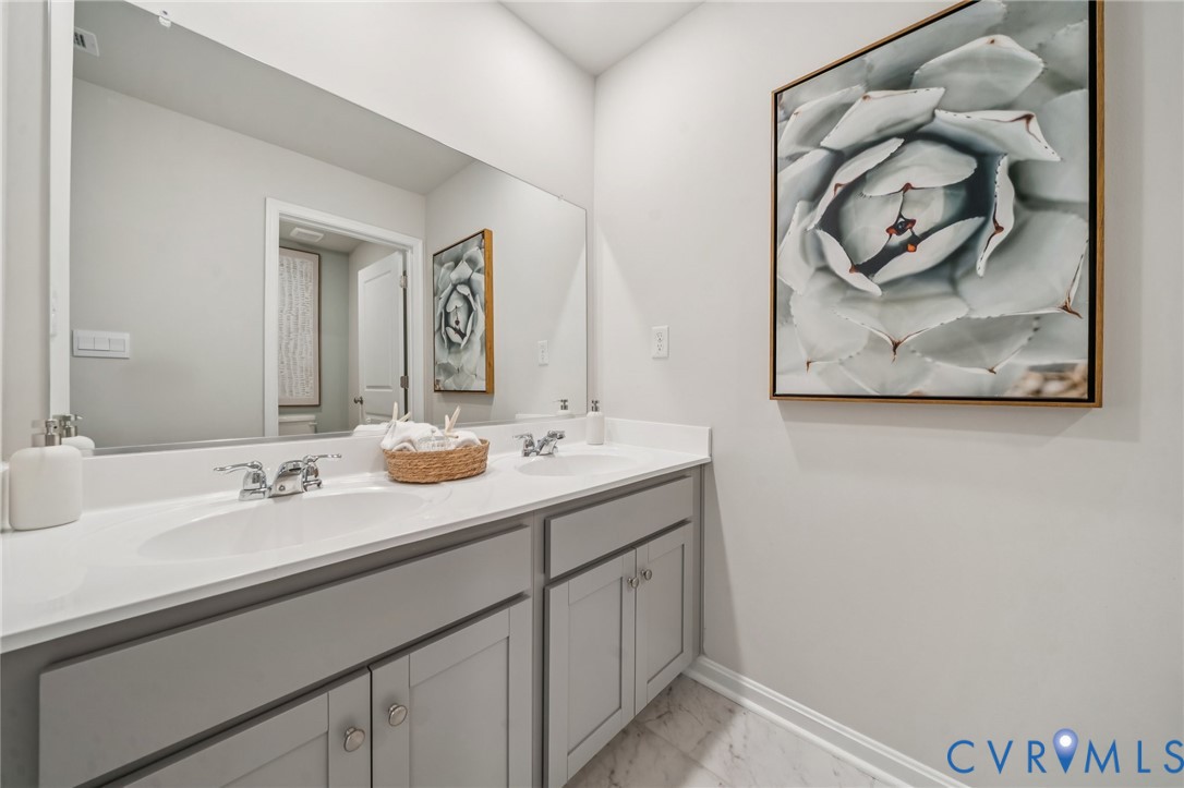 155 Liberty Lane Keswick, VA 22947 - Photo 29 of 32 a bathroom with a sink and a mirror