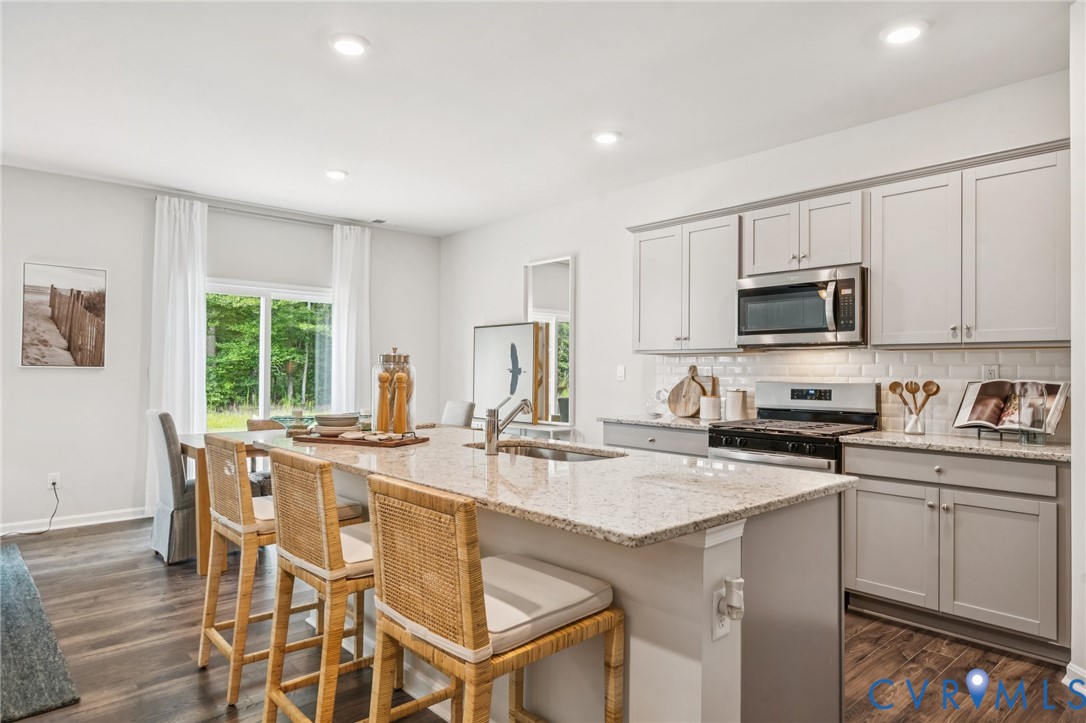 155 Liberty Lane Keswick, VA 22947 - Photo 6 of 32 a kitchen with granite countertop white cabinets and stainless steel appliances