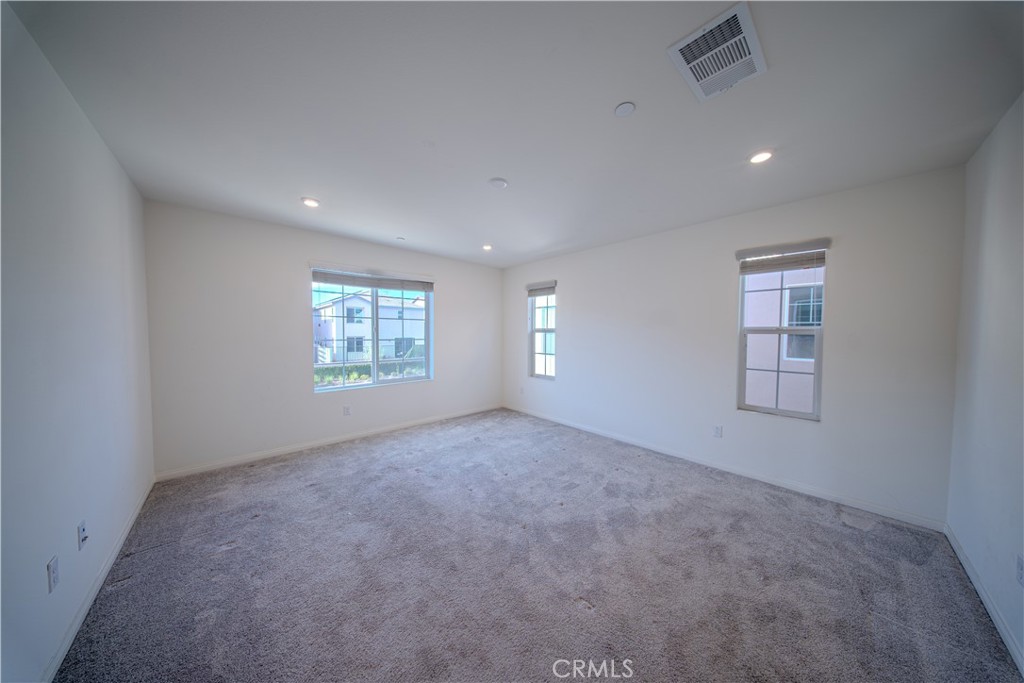 558 Pablo Road Lake Elsinore, CA 92530 - Photo 12 of 20 an empty room with windows