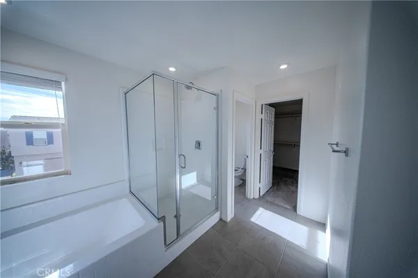 a bathroom with a tub and shower