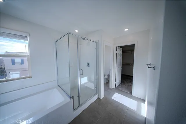a bathroom with a tub and shower