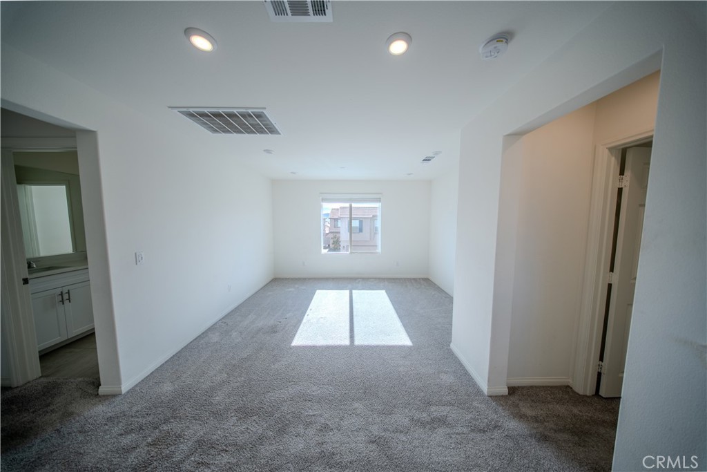 558 Pablo Road Lake Elsinore, CA 92530 - Photo 9 of 20 wooden floor in an empty room with a window
