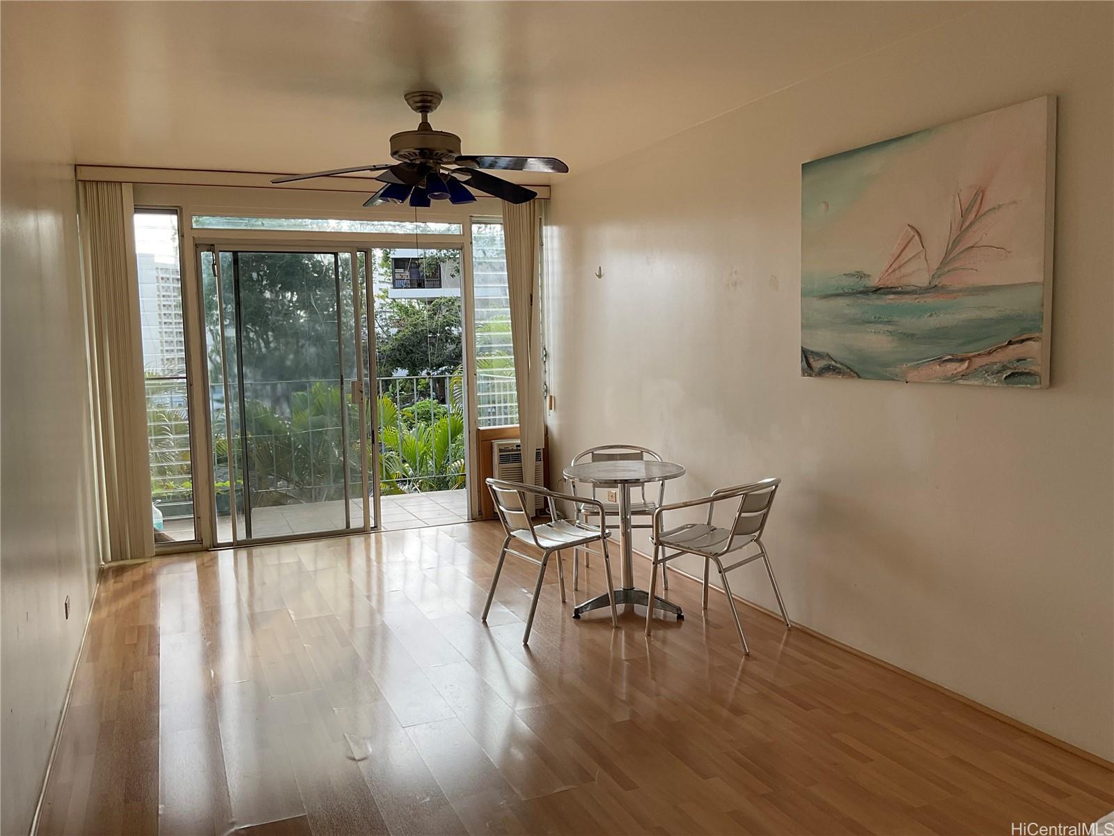 1019 Maunaihi Place, Unit 203 Honolulu, HI 96822 - Photo 1 of 19 a view of a livingroom with furniture window and wooden floor