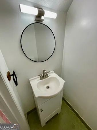 a view of an empty room and wooden floor