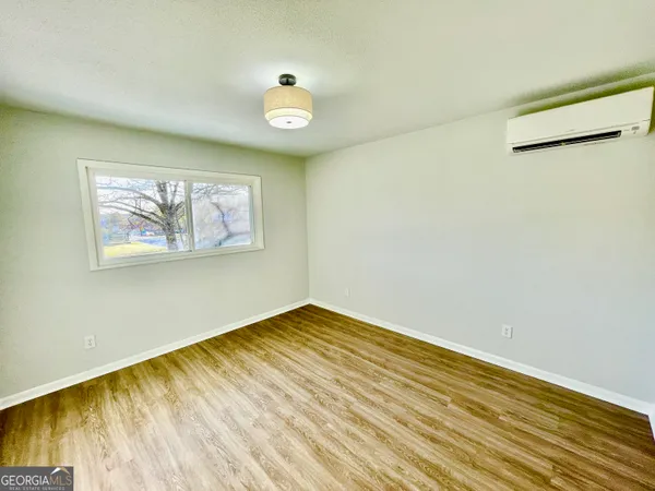 a view of a glass door with a yard from a window