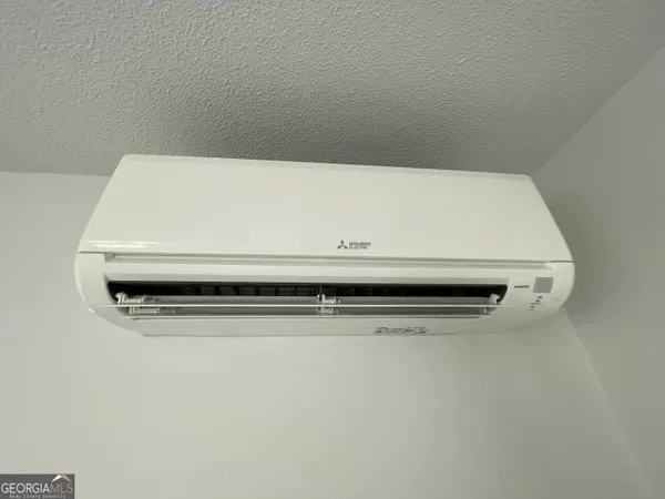 an empty room with wooden floor