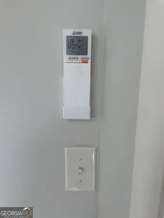 a bathroom with a sink mirror and toilet