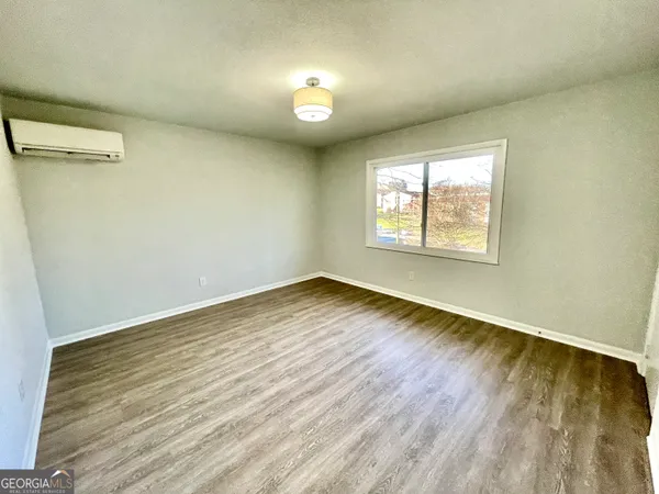 a room with a chair and gym equipment