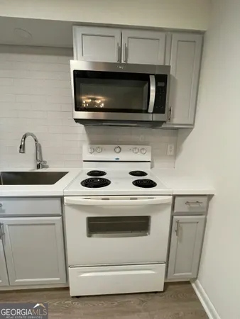 a bathroom with a sink a mirror and a bathtub