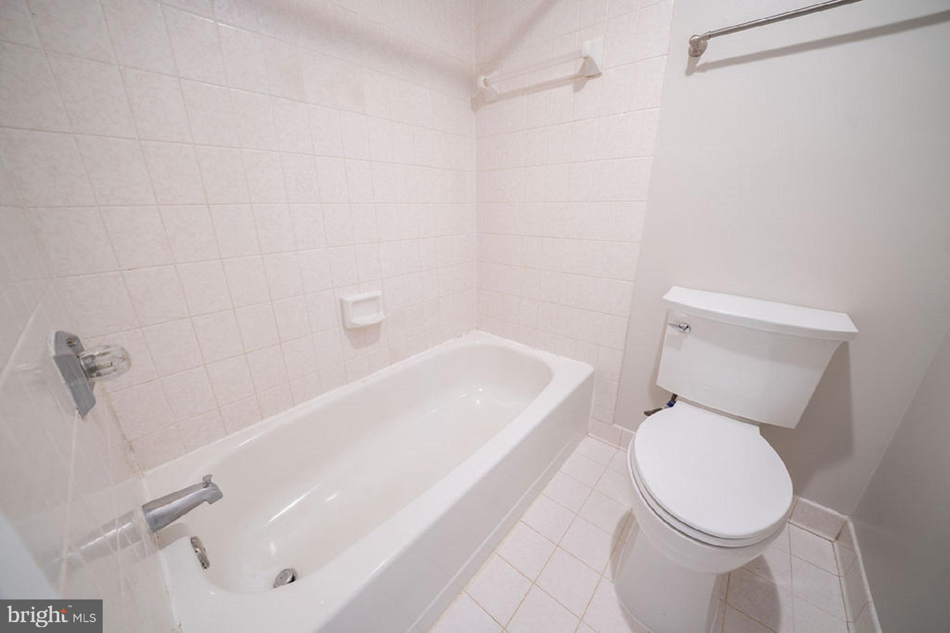5505 Seminary Road, Unit 103N Falls Church, VA 22041 - Photo 15 of 59 a white toilet sitting next to a bath tub
