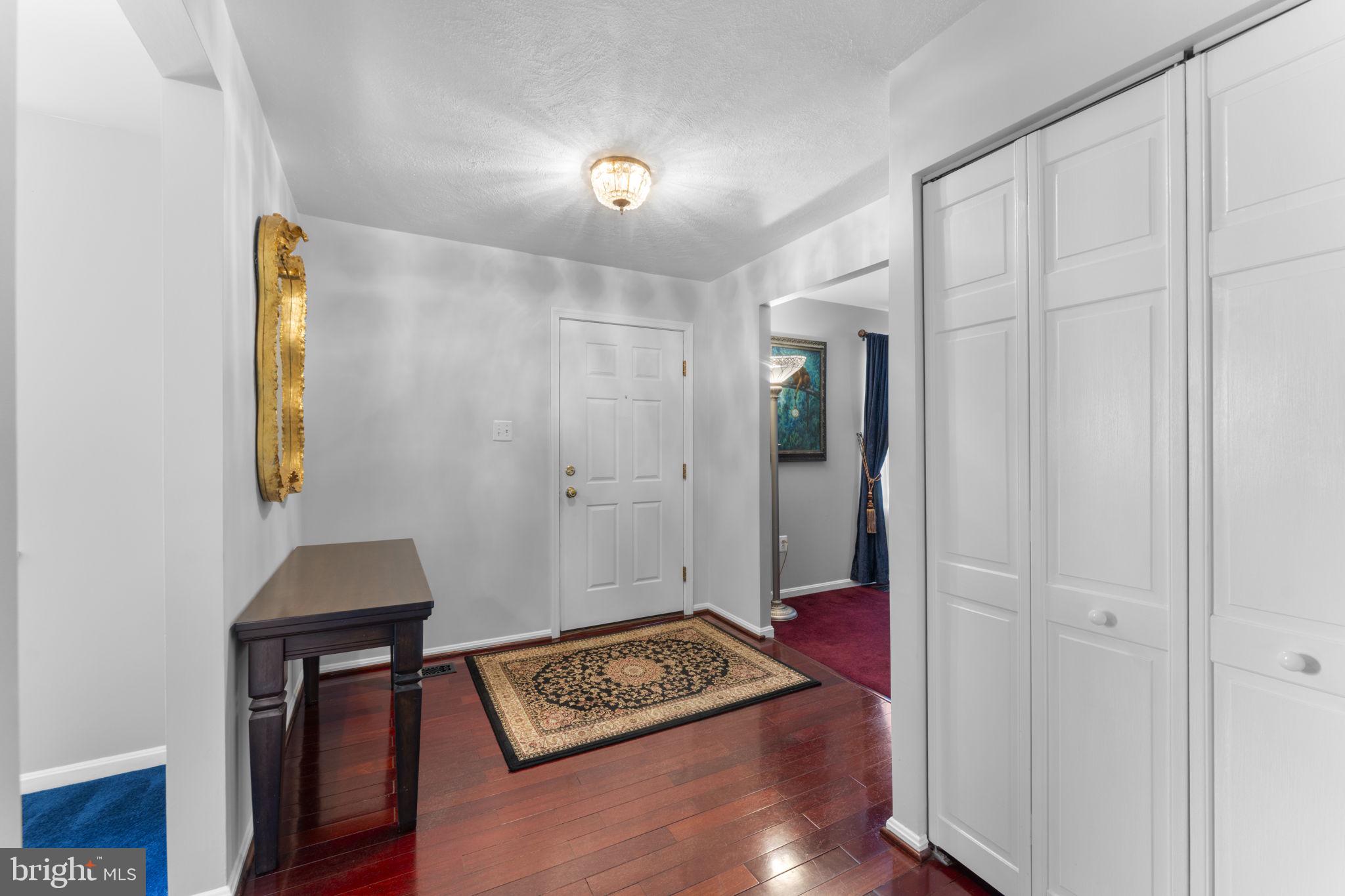 9801 Pulham Road Burke, VA 22015 - Photo 11 of 63 a view of an entryway with wooden floor