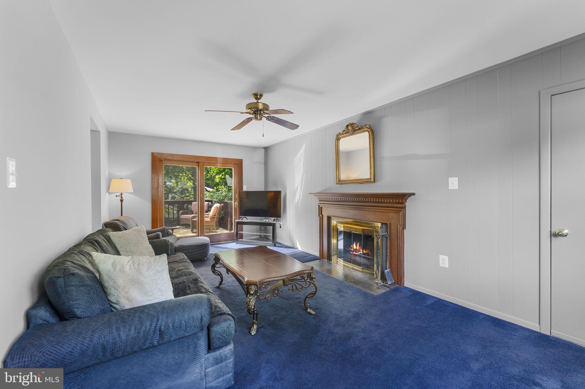 9801 Pulham Road Burke, VA 22015 - Photo 12 of 63 a living room with furniture and a fireplace