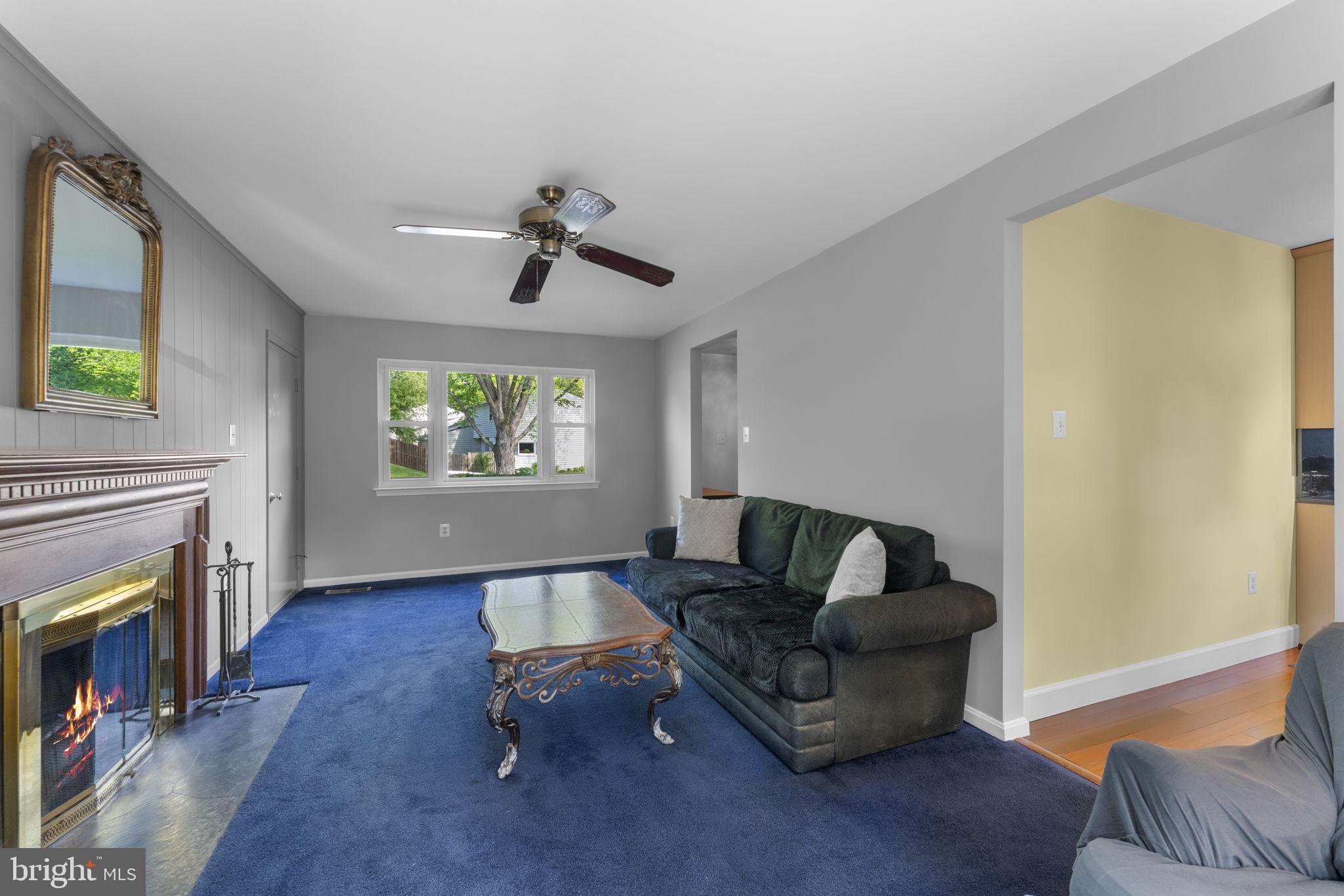 9801 Pulham Road Burke, VA 22015 - Photo 13 of 63 a living room with furniture and a fireplace